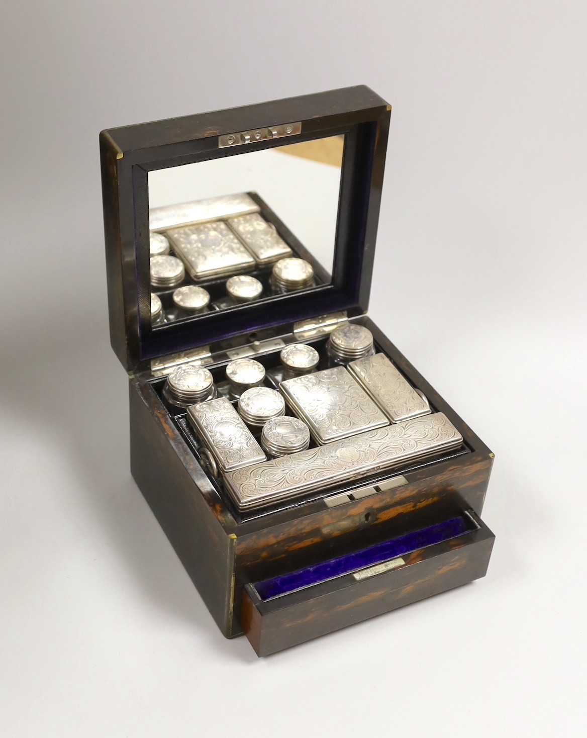 A late Victorian Mappin & Webb coromandel wood toilet box, containing ten silver mounted toilet jars, George Betjemann & Sons, London, 1895, box 21.2cm, mechanism for drawer a.f.